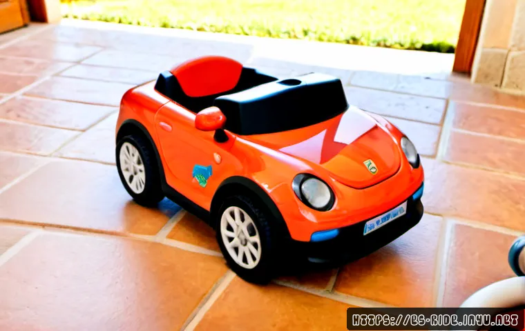 Home 17 승용완구 GPS 트래커 - Photorealistic close-up of a small black GPS tracker securely fastened beneath a child’s red ride-on...